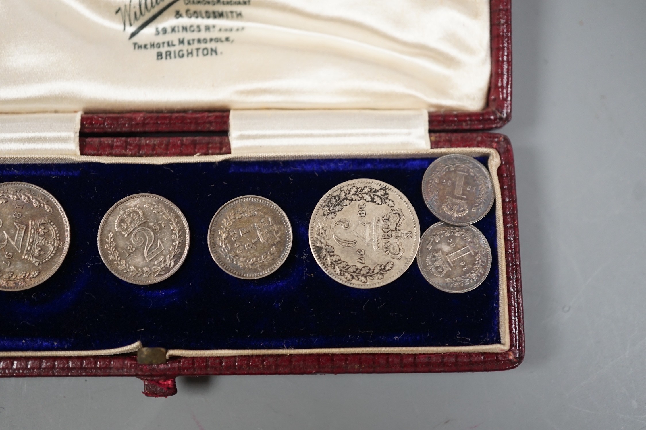 An 1897 cased maundy set and two other coins